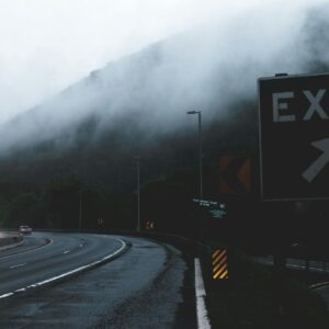 black and white exit signage on roadside